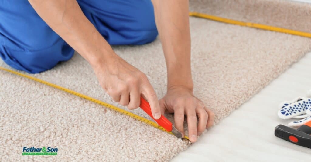Professional performing carpet patch repair service in a Utah home