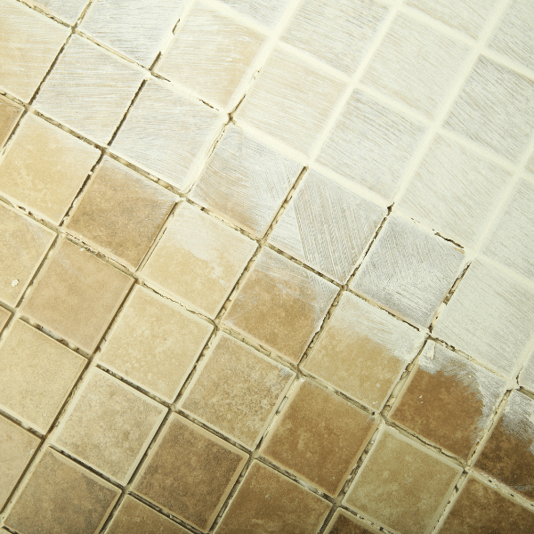 How Often Should You Clean Your Tile and Grout? - Father and Son Carpet Cleaning Close-up of dirty grout lines showing discoloration