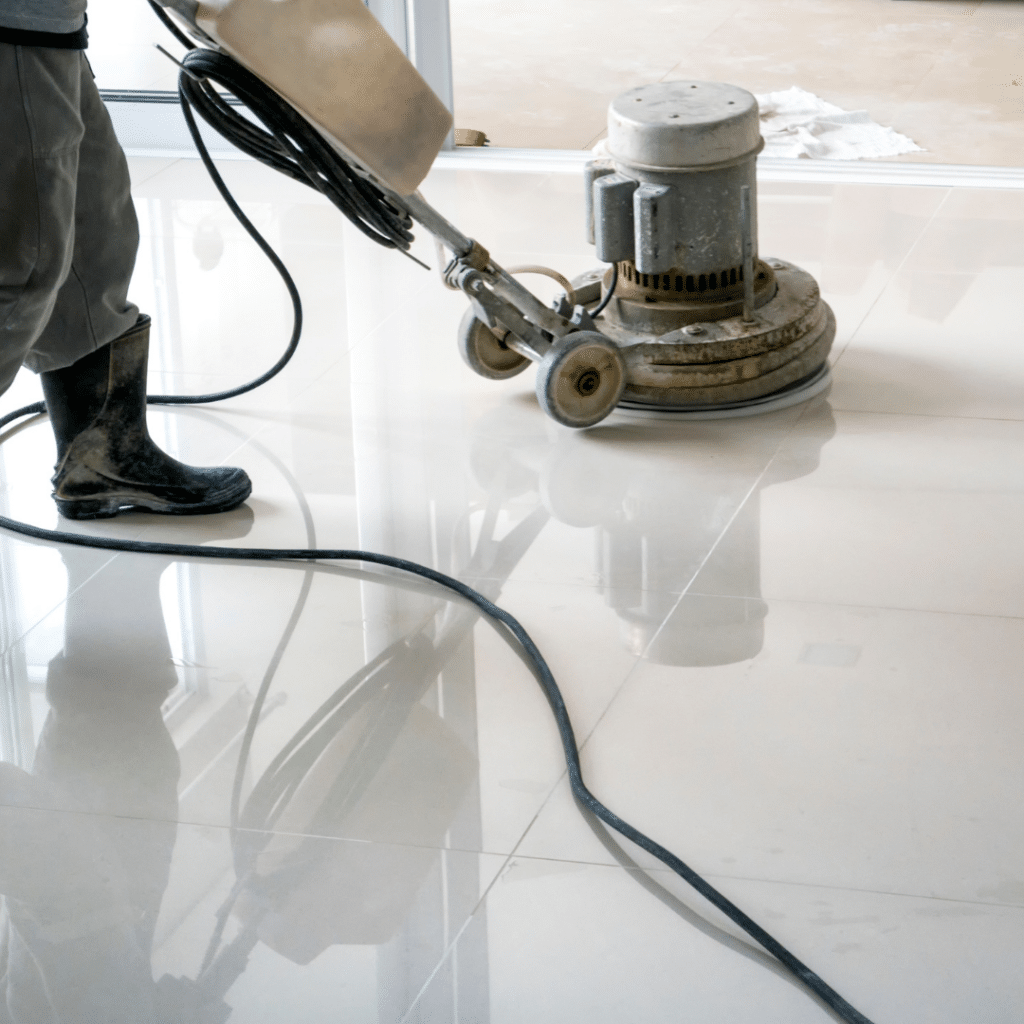 VCT Flooring Maintenance: How Often Should You Strip and Wax? - Father and Son Carpet Cleaning Technician applying floor wax during VCT stripping and waxing process.